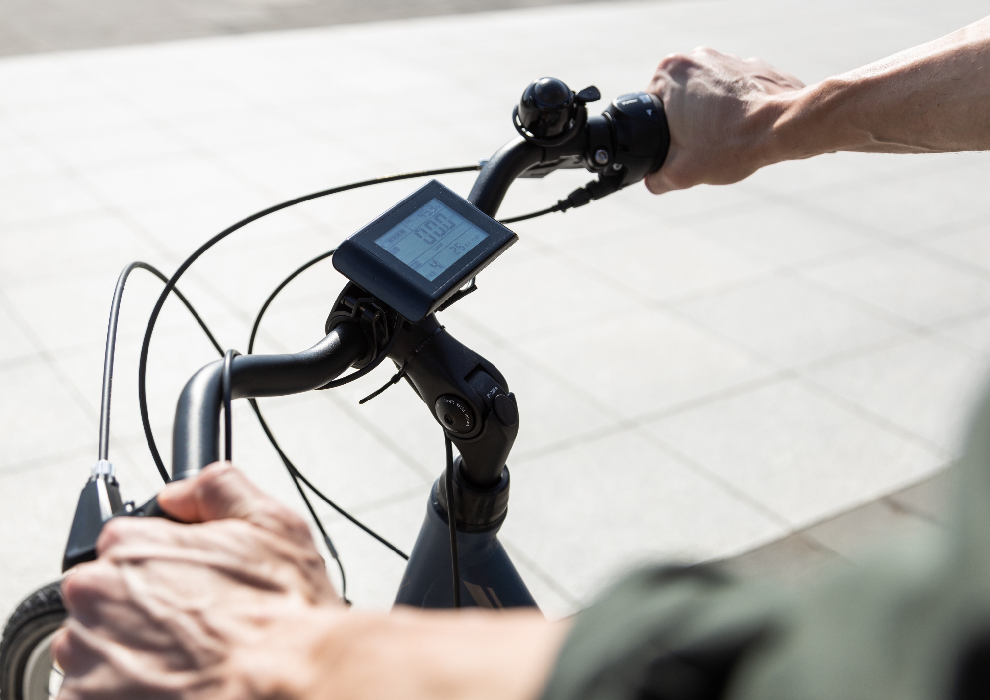 Close-up of handlebars with bike display and controls